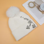 Elegant Pompom Hat with Sparkling Jewels in Cream