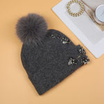 Elegant Pompom Hat with Sparkling Jewels